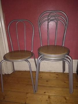 Four metal upright chairs