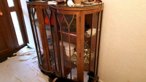 Lovely walnut and glass display cabinet and a pair of curtains