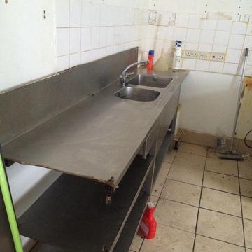 Commercial stainless steel sink unit with shelving
