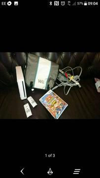 Nintendo wii with official carry bag, 2 charge packs and 1 game for swap