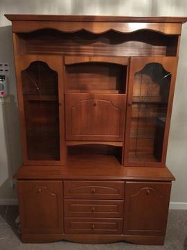 Wooden display unit with drawers and cupboards