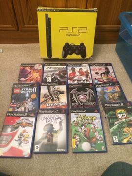 Boxed Sony slim ps2 console and games