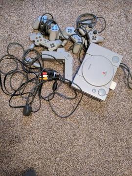 Playstation 1 with 4 original controller and 4 way controller adapter