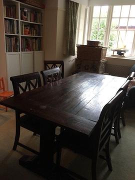 Stunning solid wood trestle style dinning table and chairs