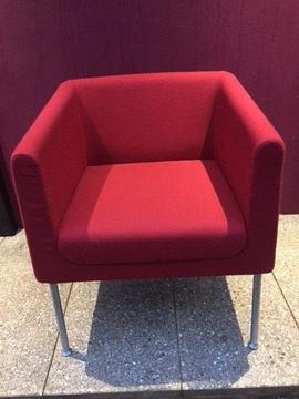 Upholstered red tub chair
