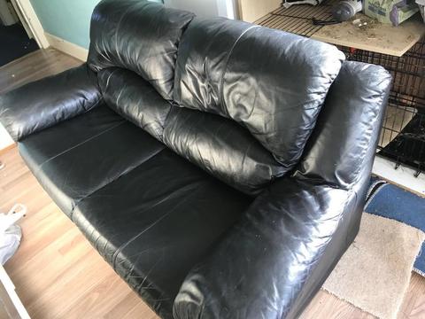 Two seater black leather sofa. Delivery