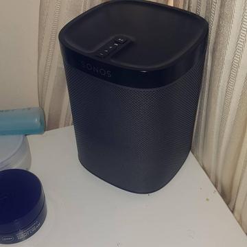 2 black Sonos speakers