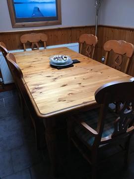 Extendable pine dining room table with six chairs