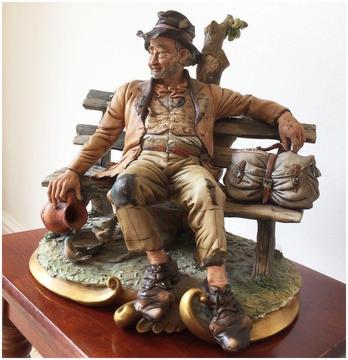 Rare and vintage Capo Di Monte figurine of tramp on a bench in excellent condition