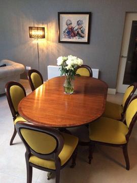Mahogany dining table with antique Victorian chairs