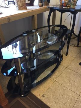 Oval black and silver tv stand