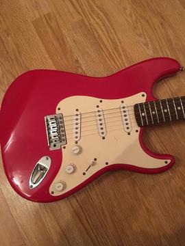 Squier Stratocaster and Roland amp combo
