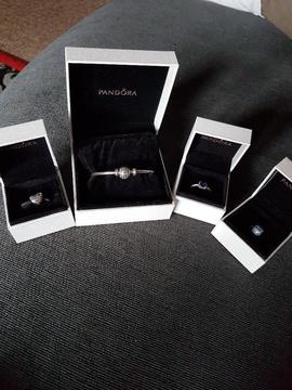 Pandora bracelet, ring and 2 charms... less them a month old