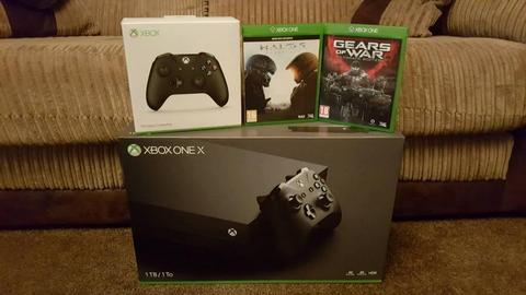 Xbox one x , 1 week old as new