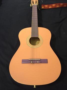 Small quirky pink guitar