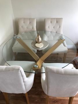 Solid oak table with glass top and four chairs