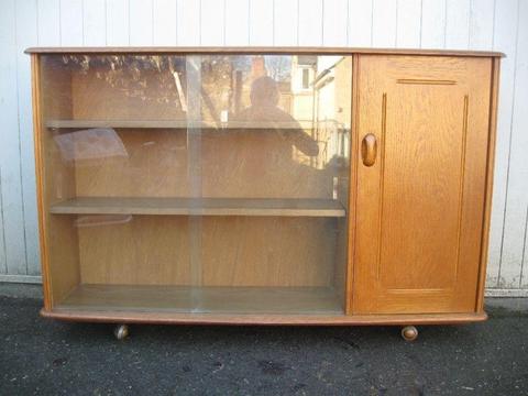Ercol or Ercol style glazed book case cupboard vintage light colour