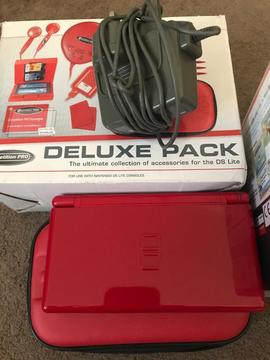 Red Nintendo ds lite with games and case