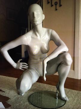Female mannequin with glass stand
