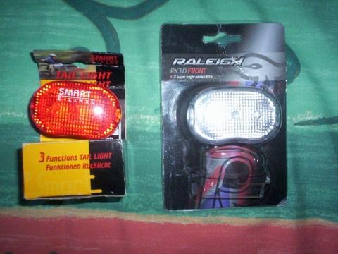 Raleigh Front and Smart E-Lines rear bike lights. Each has three modes, takes 2 x AAA batteries