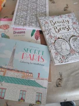 Seven partly used colouring books