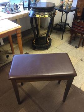 Brown piano stool