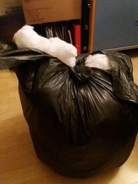 Bin bag full of cushion filling