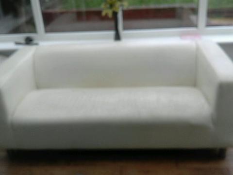 white faux leather sofa