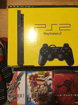 PS2 Slim Console in original box with all cables, three games and BUZZ controllers