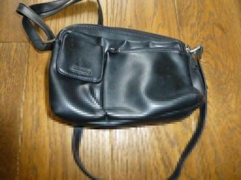 barely used small black leather effect multi pocket handbag with shoulder strap
