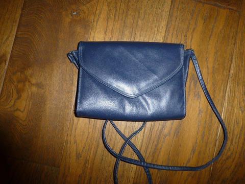 barely used small navy leather handbag with shoulder strap