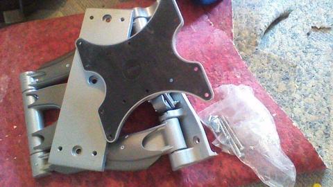 TH wall mount; OMNI Mount. Very solid in silver finish metal. intact with screws