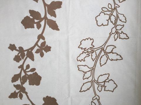 Cream curtain/upholstery fabric with beige raised leaf design