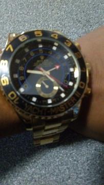 Mens rolex watch in black and gold