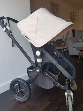 Bugaboo Cameleon 2 black frame with off white hoods and accessories