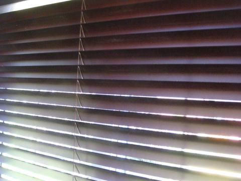 Brown wooden Venetian blinds