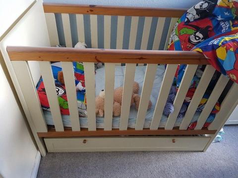 Cream cot with draw underneath