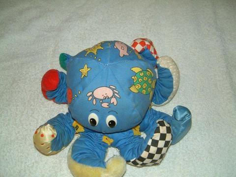 Soft Octopus, rattles and makes a tune when shaken, clean used condition