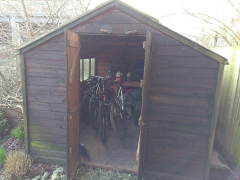 Large wooden shed is ready for collection after dismantling