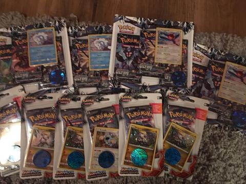 Triple blister packs of Pokemon cards - Ultra Prism booster packs