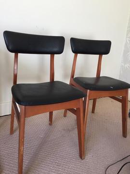 Two black wooden chairs