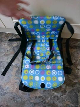 Munchkin travel booster seat