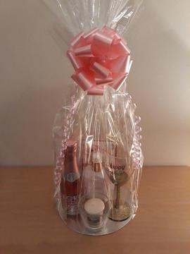 Gift sets from £8, includes Wine, Glass, Chocs & other item's, depends what youre looking for