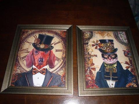 2 NEW STEAMPUNK STYLE DOG AND CAT PRINTS IN BRONZE/GOLD GLASS FRAMES. 12 inch by 10inch frames