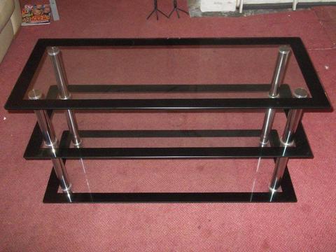 TV Stand in Chrome and glass (with black edging). Size: W100cmxH56cmxD40cm. Good condition