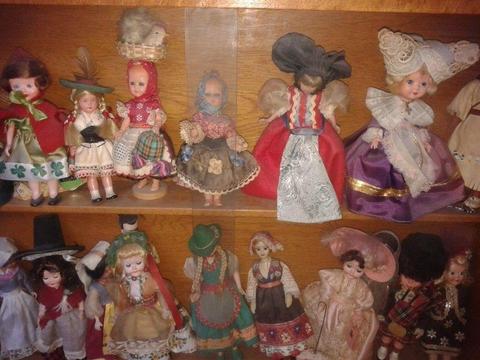 16 little dolls in National Costumes from European and Asian Countries are looking for a good home