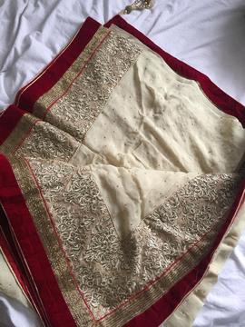 Georgette cream saree with red and gold border