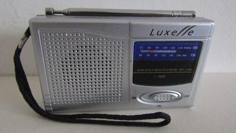 LUXELLE AM/FM POCKET PORTABLE RADIO. WORKS GREAT!