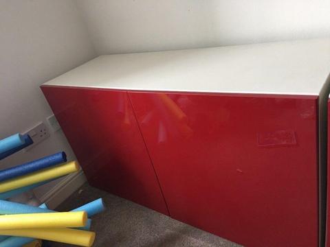 White double Ikea cupboard with red gloss doors
