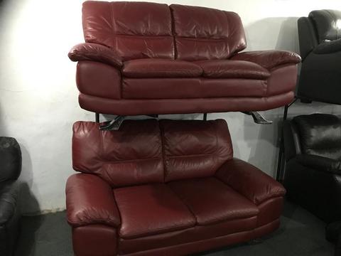 2 red leather 2 seater sofas